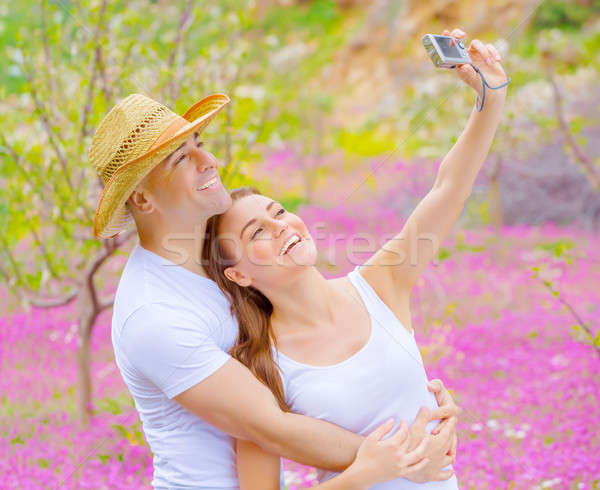 Cute couple photographing of themself Stock photo © Anna_Om