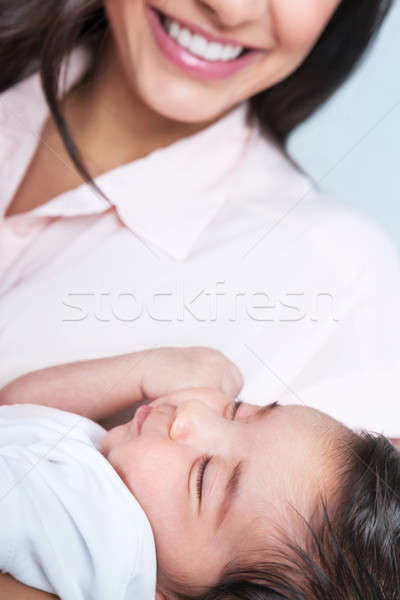 Stock photo: Sleeping baby on mothers hands