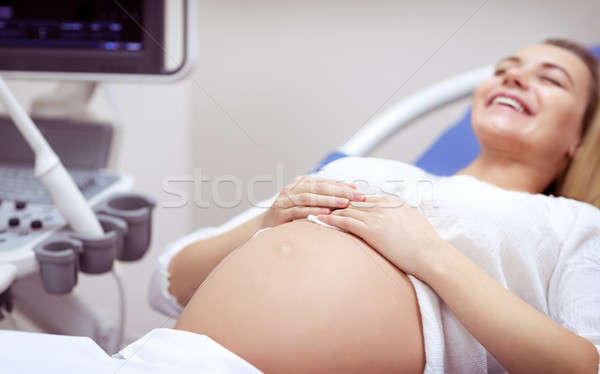 Happy pregnant woman on ultrasound Stock photo © Anna_Om
