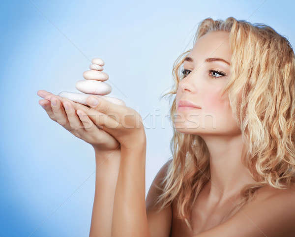 Cute woman with spa stones Stock photo © Anna_Om