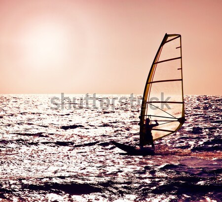 Silhouette windsurfer over sunset Stock photo © Anna_Om