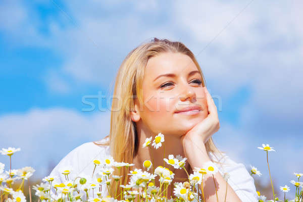 Stock photo: Pretty woman on daisy meadow