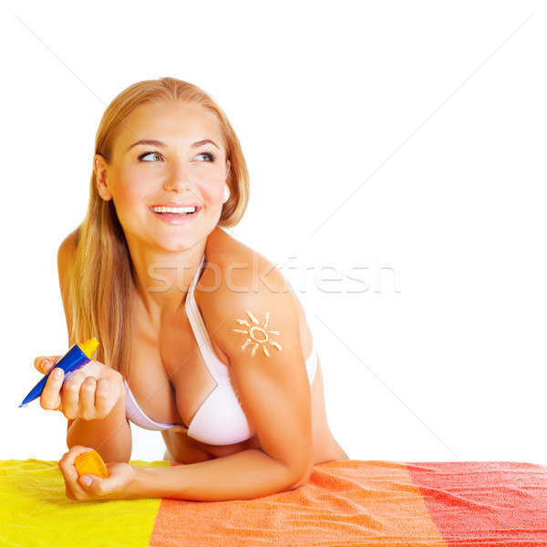 Pretty woman applying suncream Stock photo © Anna_Om