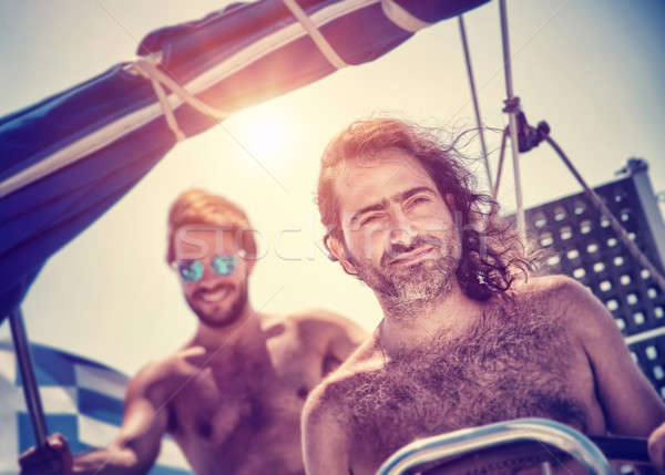 Two men on sailboat Stock photo © Anna_Om