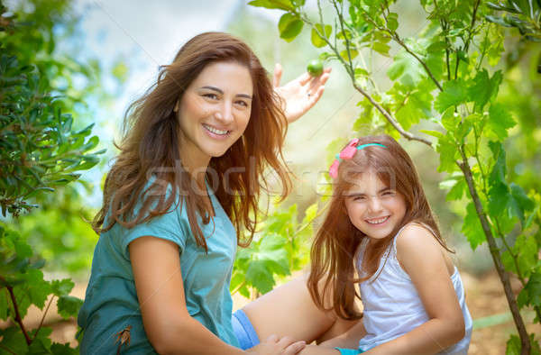 Mother with daughter in the orchard Stock photo © Anna_Om