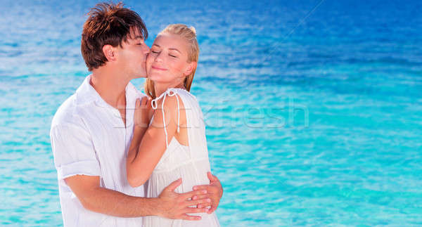 Happy couple kissing on the beach Stock photo © Anna_Om