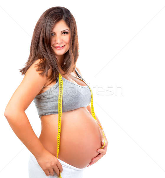 Expectant girl with centimeter tape Stock photo © Anna_Om