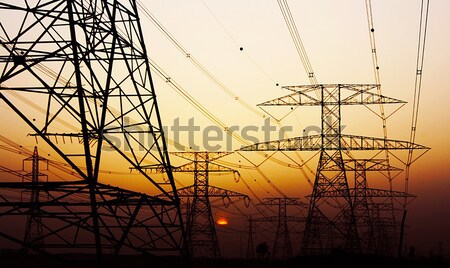 Eletricidade pôr do sol escuro céu ambiental dano Foto stock © Anna_Om
