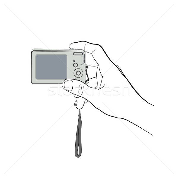 Stock photo: Male hand line art style with colored digitl camera. 