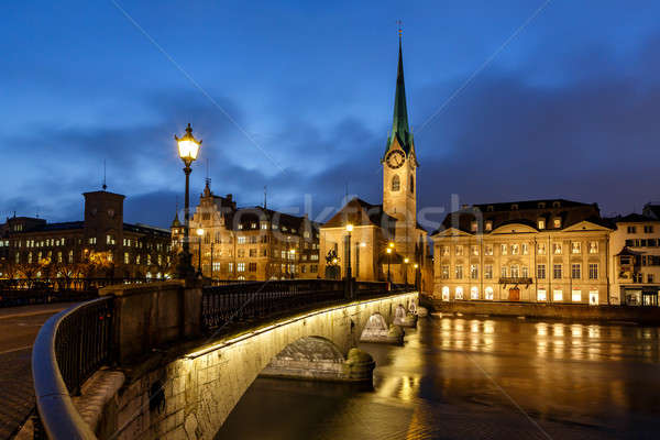 Illuminated Fraumunster Church and River Limmat in Zurich, Switz Stock photo © anshar