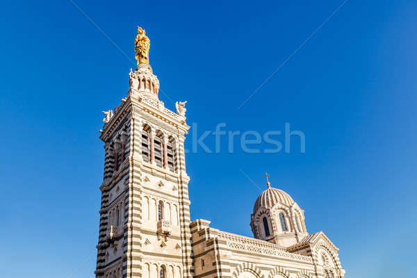 Golden Statue of the Madonna Holding the little Jesus on the top Stock photo © anshar