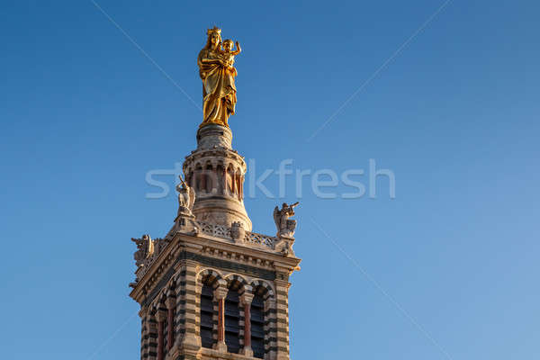 Golden Statue of the Madonna Holding the little Jesus on the top Stock photo © anshar