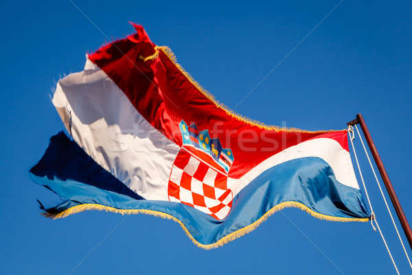 Croatian Flag Waving on a Pole over Beautiful Blue Sky in Omis,  Stock photo © anshar
