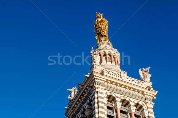 Golden Statue of the Madonna Holding the little Jesus on the top Stock photo © anshar
