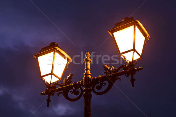 Street Lamp Shining at Night against Dramatic Cloudy Sky Stock photo © anshar