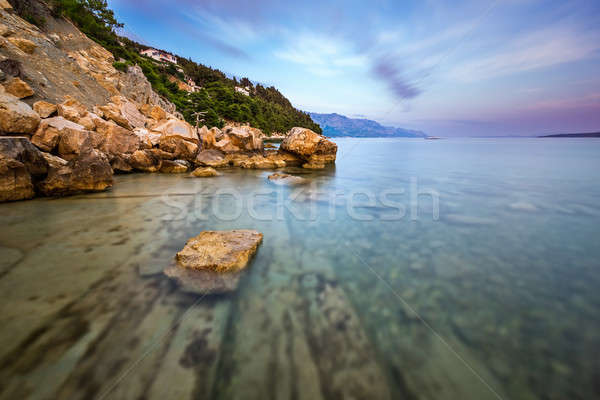 Rocky Beach and Transparent Adriatic Sea near Omis in the Evenin Stock photo © anshar