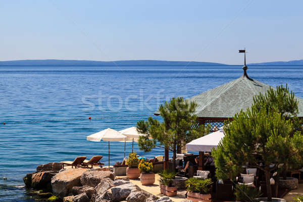 Stock photo: Two Loungers Under Sun Umbrella at the Beach Restaurant in Opati