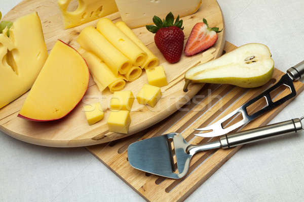 A set of cheese on a wooden board Stock photo © Antartis