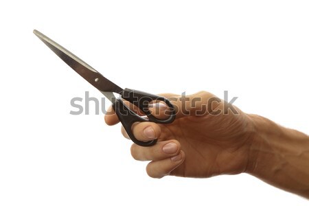 Scissors in mans hand Stock photo © Antartis
