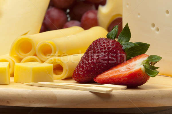 A set of cheese on a wooden board Stock photo © Antartis