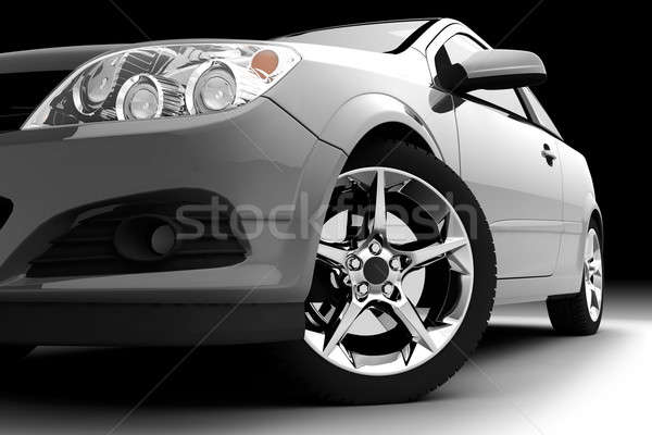 Stock photo: Car front bumper, light and wheel on black