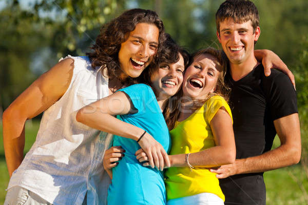 A group of young people having fun in the park Stock photo © Antartis