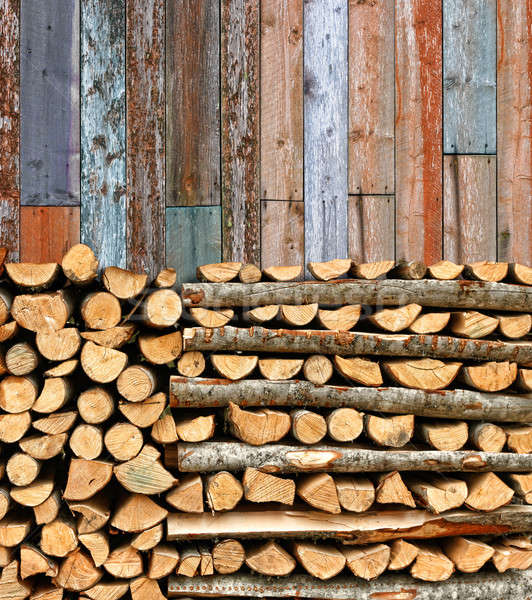 Stacked firewood colorful batten wall Stock photo © Anterovium