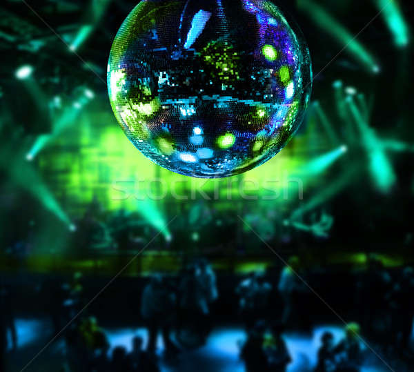 Dancing under disco mirror ball Stock photo © Anterovium