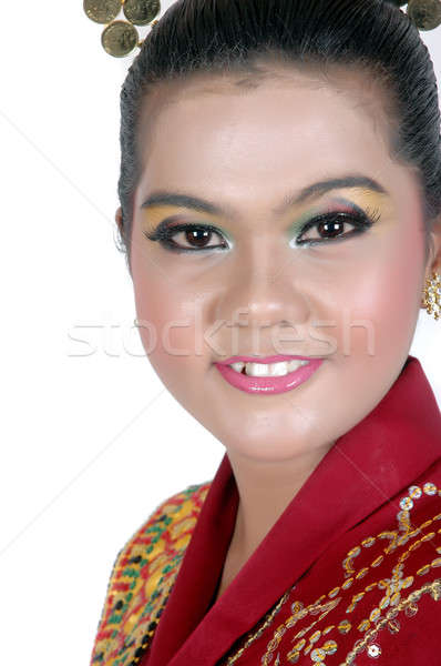 Stock photo: portrait of an asian young girl dressed in traditional indigenous tribal borneo 