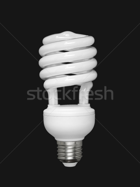 Fluorescent light bulb over black Stock photo © antonprado