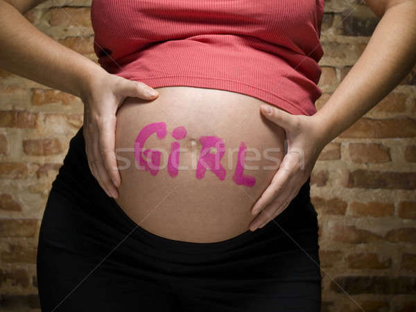 Dziewczyna kobieta w ciąży słowo napisany brzuch kobieta Zdjęcia stock © antonprado