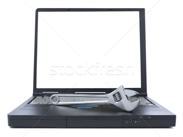 Technikai támogatás csavarkulcs fekete laptop izolált fehér Stock fotó © antonprado