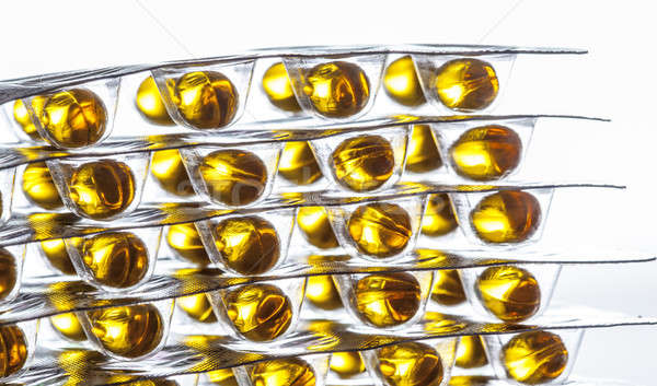 Halolaj tabletták fehér orvosi háttér olaj Stock fotó © arcoss