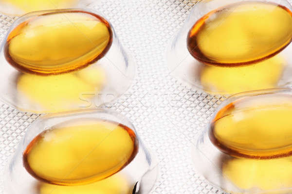 Рыбий жир таблетки белый медицинской фон нефть Сток-фото © arcoss
