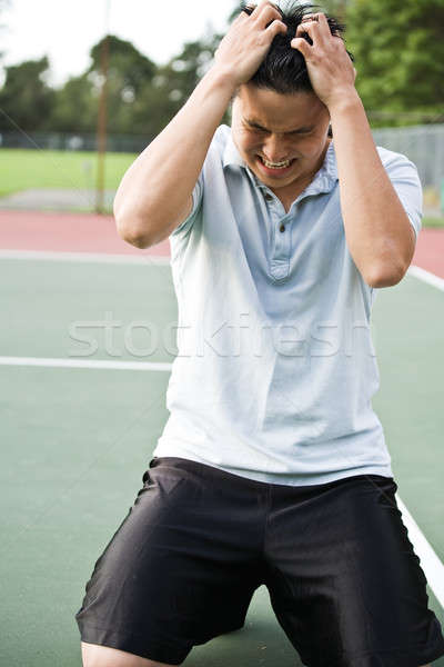 Teleurgesteld tennisspeler asian nederlaag tennis wedstrijd Stockfoto © aremafoto