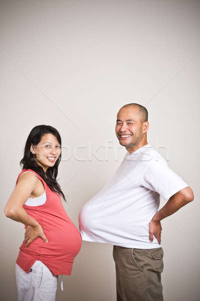 Happy expecting pregnant asian couple Stock photo © aremafoto