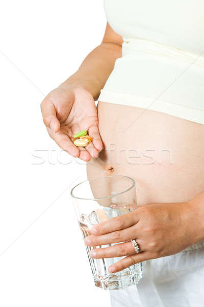 Zwangere vrouw geïsoleerd shot glas water Stockfoto © aremafoto