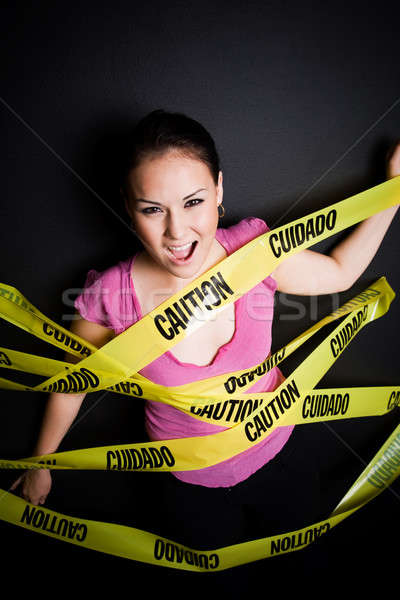 Businesswoman trapped in caution tape Stock photo © aremafoto