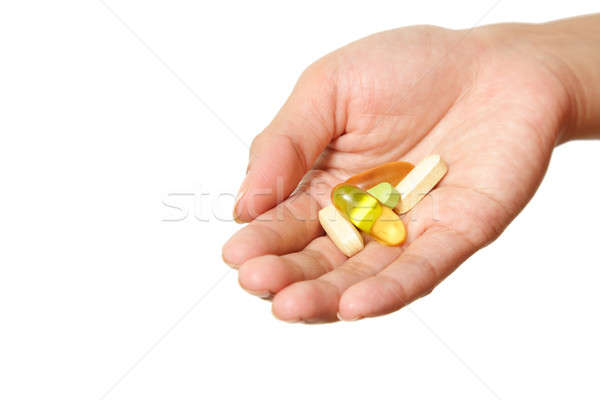 Holding vitamins Stock photo © aremafoto