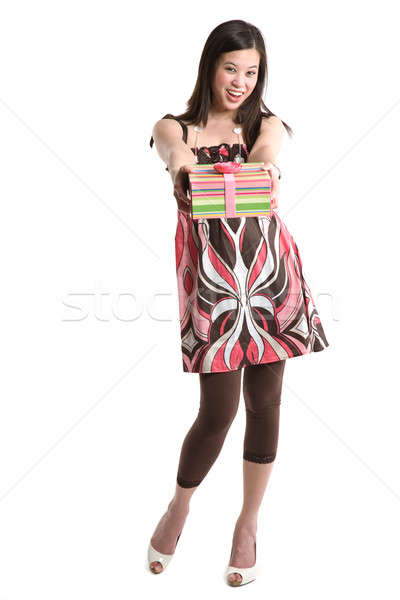 Asian woman giving a gift Stock photo © aremafoto