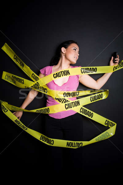 Businesswoman trapped in caution tape Stock photo © aremafoto