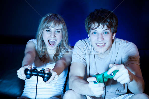 çift oynama video oyunları atış oturma odası Stok fotoğraf © aremafoto