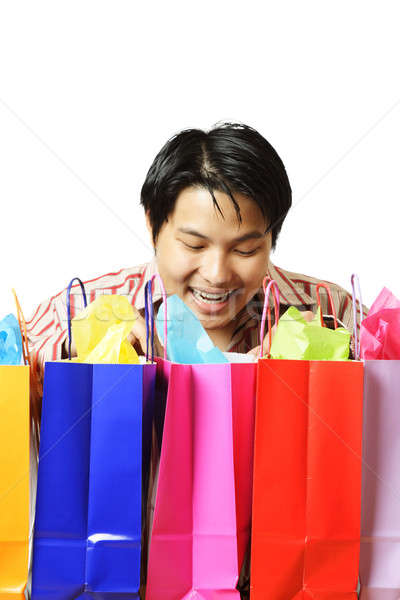 Shopping isolé coup heureux jeune homme Photo stock © aremafoto
