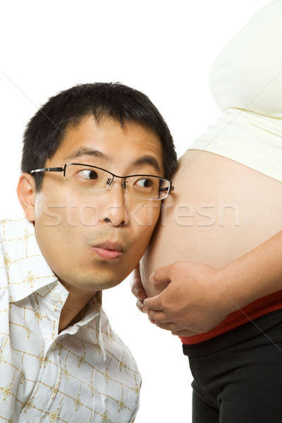 Padres aislado tiro padre escuchar feto Foto stock © aremafoto