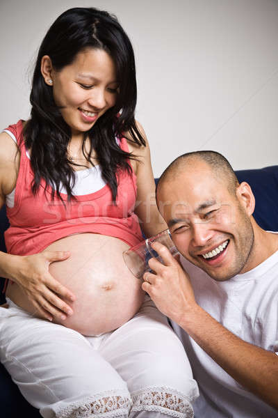 Happy expecting asian parents Stock photo © aremafoto