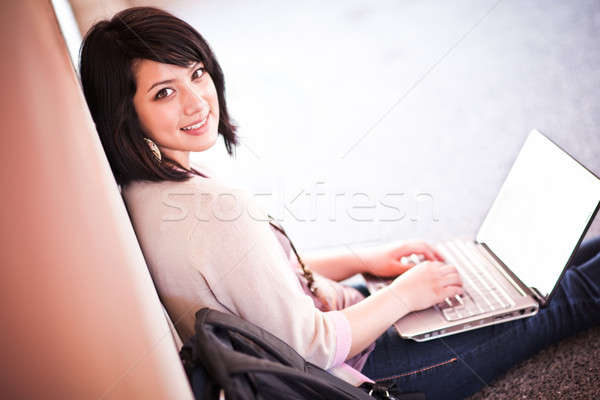 Stock photo: Mixed race college student with laptop