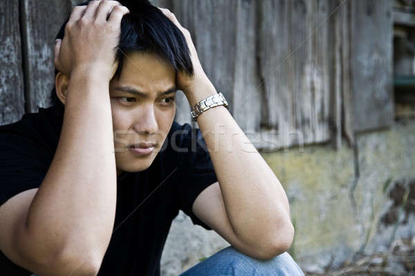 Stressed asian male Stock photo © aremafoto