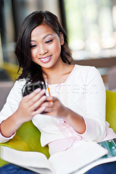 Asian student texting Stock photo © aremafoto