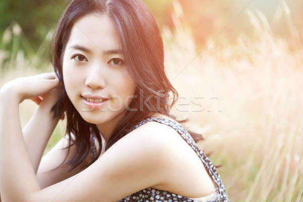 Hermosa Asia mujer aire libre flor Foto stock © aremafoto