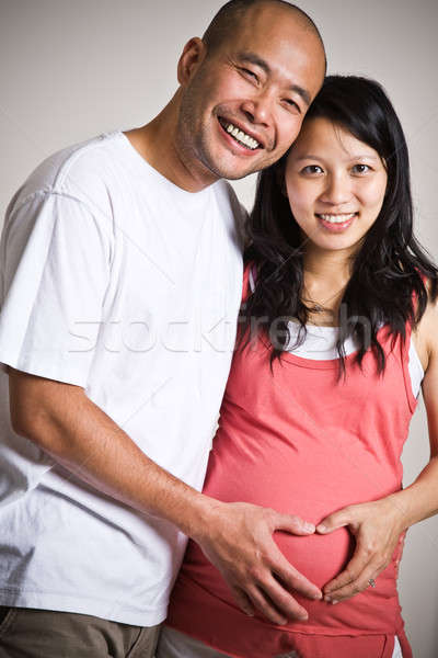 Pregnant asian couple Stock photo © aremafoto